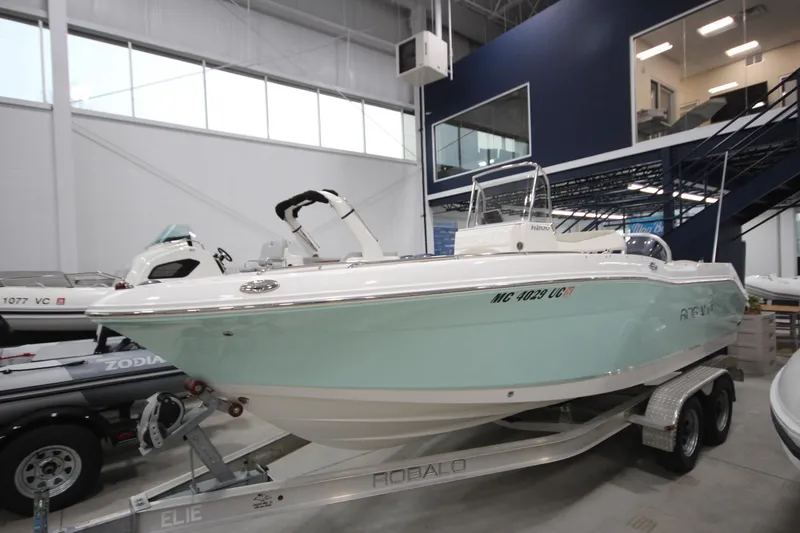 Slide: The Image of 2016 Robalo R200 Center Console boat on trailer in showroom. - 25