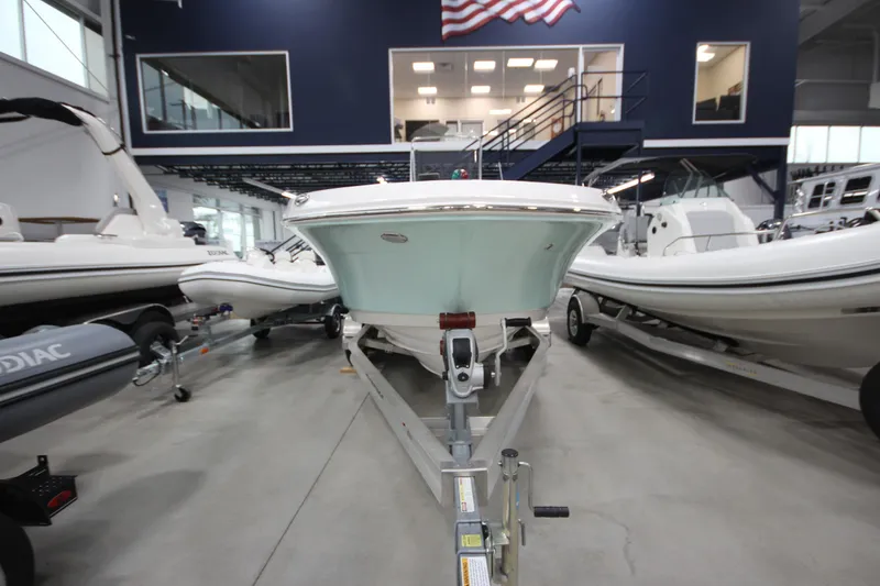 Slide: The Image of 2016 Robalo R200 Center Console boat on trailer in showroom. - 27