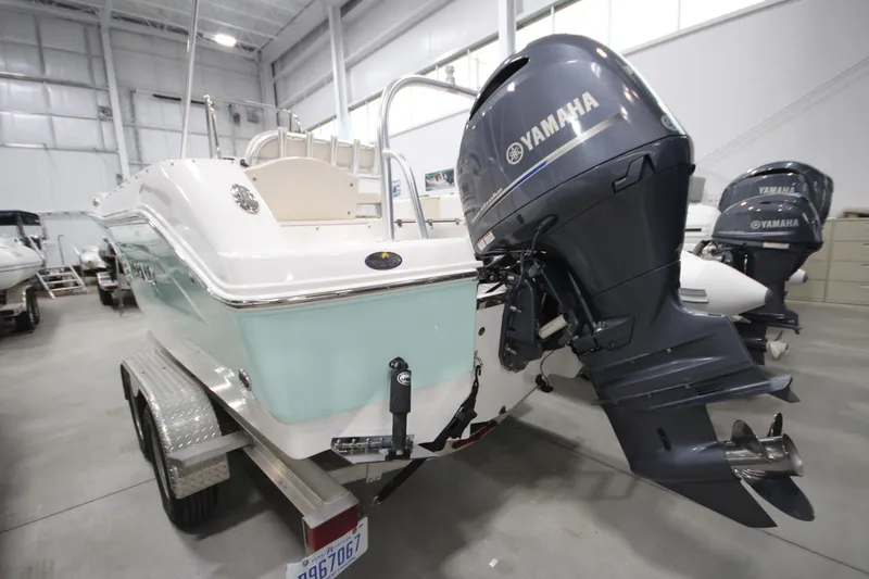 Slide: The Image of 2016 Robalo R200 Center Console boat with Yamaha outboard motor in a showroom. - 29
