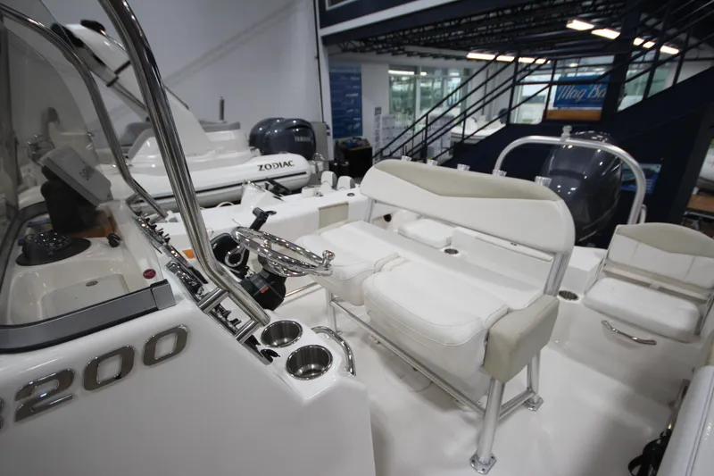 Slide: The Image of 2016 Robalo R200 Center Console boat interior with seating and controls. - 34