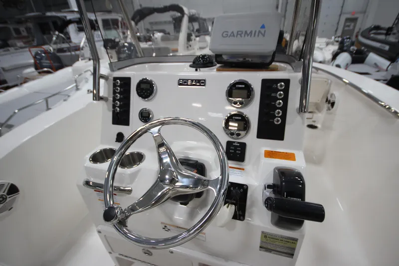 Slide: The Image of 2016 Robalo R200 Center Console boat dashboard with Garmin navigation system. - 36