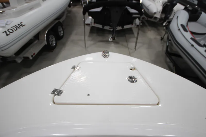 Slide: The Image of 2016 Robalo R200 Center Console boat deck, featuring storage hatch and sleek design. - 42