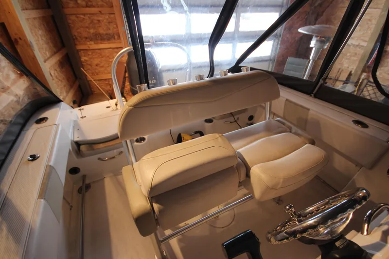 Slide: The Image of 2016 Robalo R200 Center Console boat interior with helm and seating. - 6