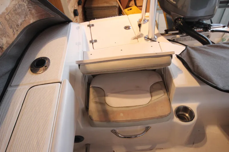 Slide: The Image of 2016 Robalo R200 Center Console boat interior with seating and storage compartments. - 7