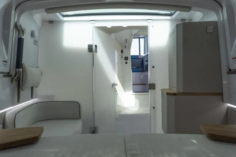 Slide: The Image of Interior of 2026 Axopar 37 XC Cross Cabin, featuring modern design and comfortable seating. - 13