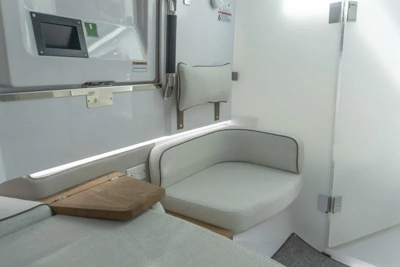 Slide: The Image of Interior of 2026 Axopar 37 XC Cross Cabin, featuring modern seating and sleek design. - 14