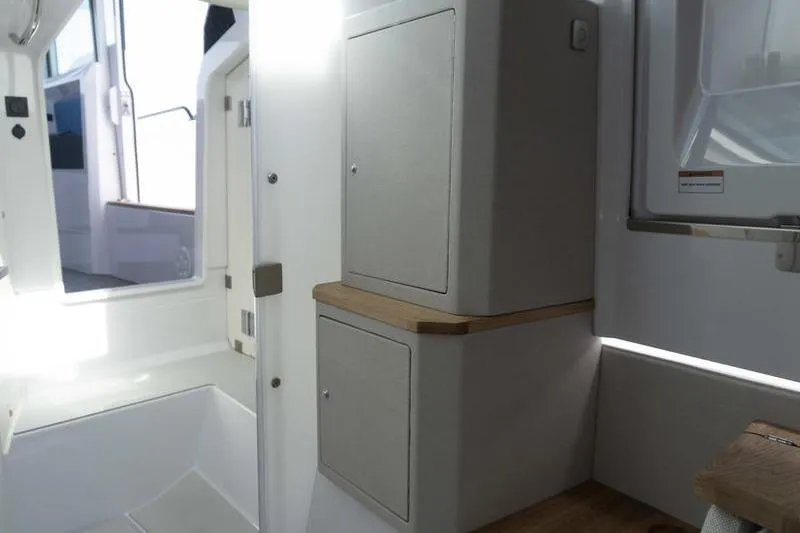 Slide: The Image of Interior of 2026 Axopar 37 XC Cross Cabin, featuring sleek cabinetry and modern design. - 15