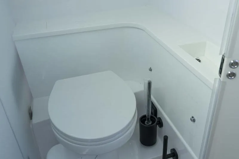 Slide: The Image of Compact bathroom in 2026 Axopar 37 XC Cross Cabin boat. - 16