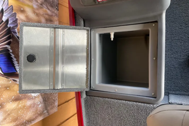Slide: The Image of Open storage compartment in 2024 Tracker Bass Tracker Classic XL boat. - 14