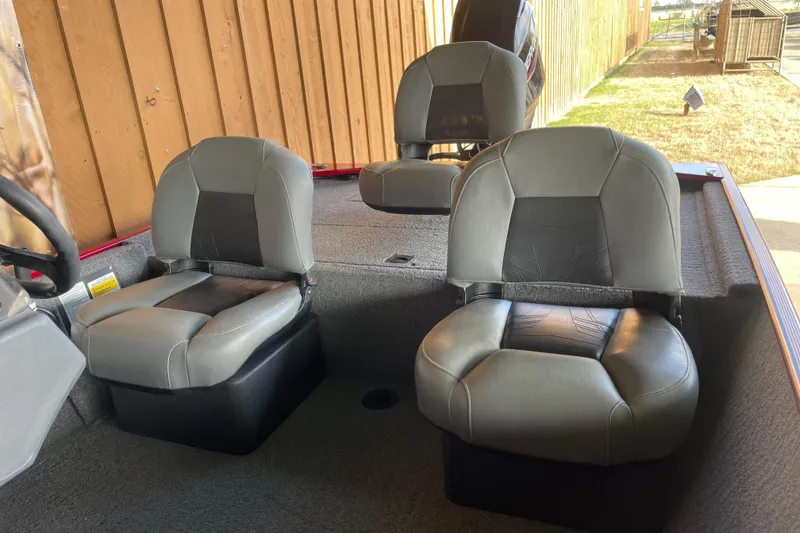 Slide: The Image of 2024 Tracker Bass Tracker Classic XL boat interior with two gray seats. - 4