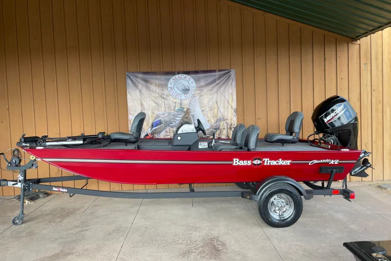 Slide: The Image of 2024 Tracker Bass Tracker Classic XL boat in vibrant red on display. - 7