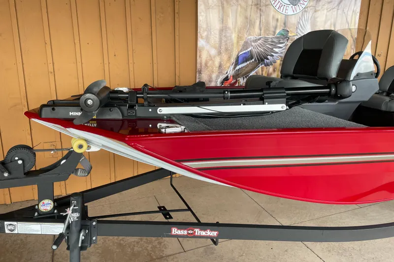 Slide: The Image of 2024 Tracker Bass Tracker Classic XL boat in vibrant red on a trailer. - 8