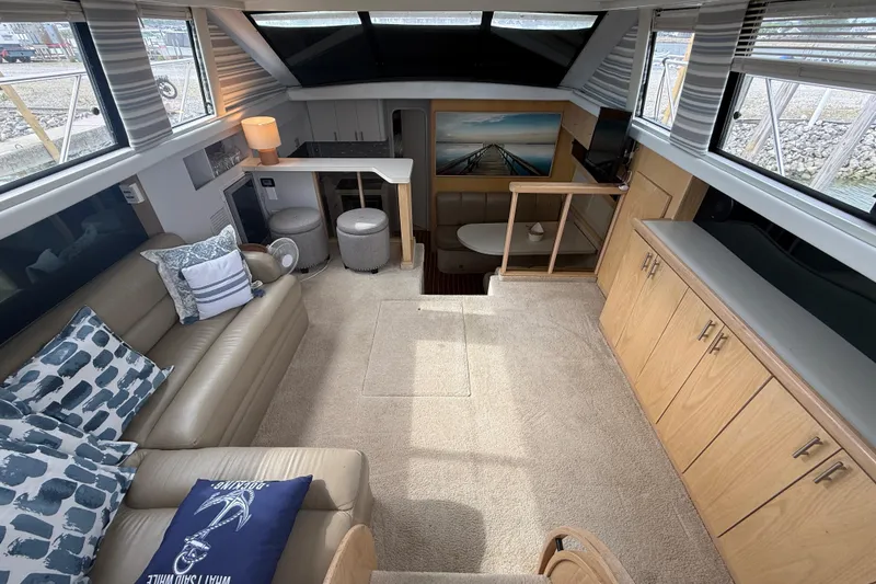 Slide: The Image of Luxurious interior of a 1992 Silverton 41 Motor Yacht with elegant furnishings and ample natural light. - 18