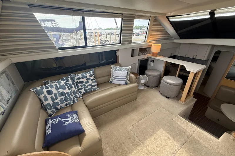 Slide: The Image of Luxurious interior of a 1992 Silverton 41 Motor Yacht with cozy seating and elegant decor. - 19
