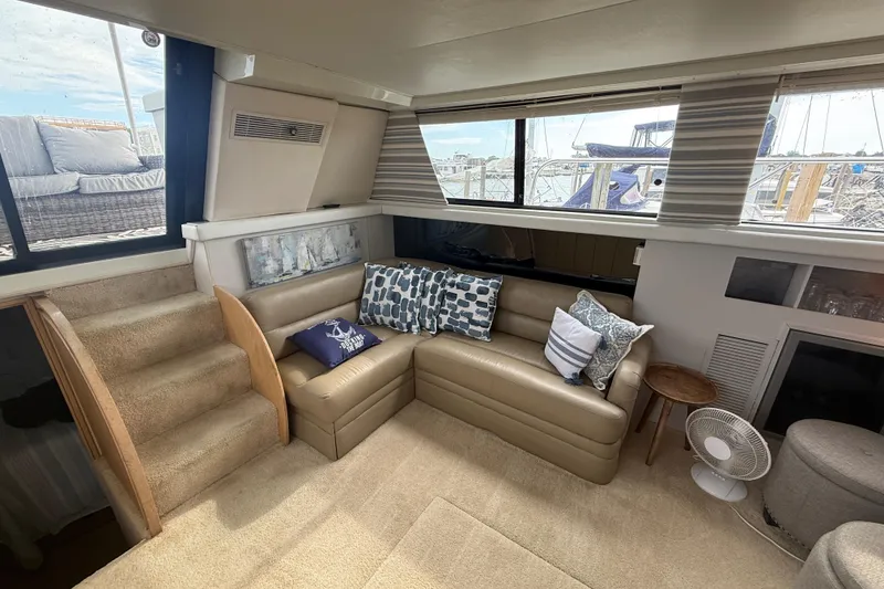 Slide: The Image of Interior of 1992 Silverton 41 Motor Yacht with cozy seating and nautical decor. - 20