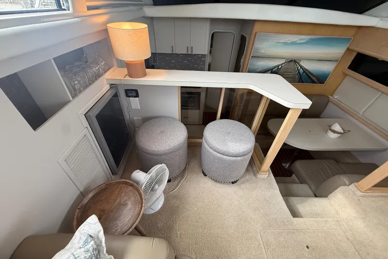 Slide: The Image of Interior of 1992 Silverton 41 Motor Yacht with modern decor and seating area. - 22