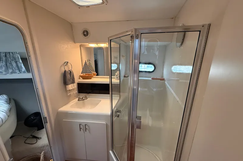 Slide: The Image of Bathroom interior of 1992 Silverton 41 Motor Yacht with shower and sink. - 29