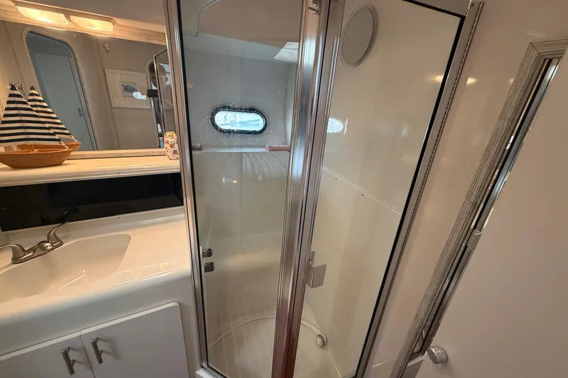 Slide: The Image of Bathroom interior of 1992 Silverton 41 Motor Yacht with shower and sink. - 31