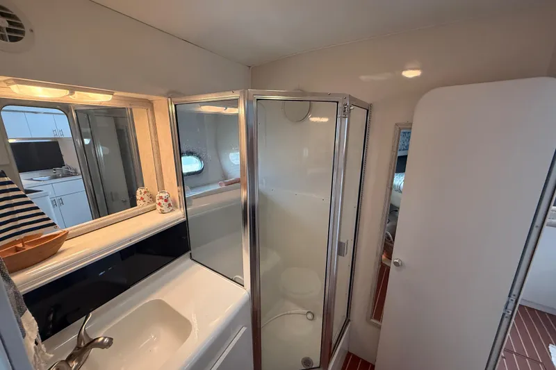 Slide: The Image of Bathroom interior of 1992 Silverton 41 Motor Yacht with shower and sink. - 36