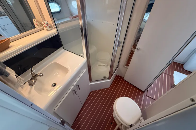 Slide: The Image of Bathroom interior of 1992 Silverton 41 Motor Yacht with sink, shower, and toilet. - 37