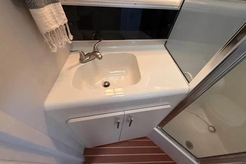 Slide: The Image of Bathroom sink and shower in 1992 Silverton 41 Motor Yacht. - 38