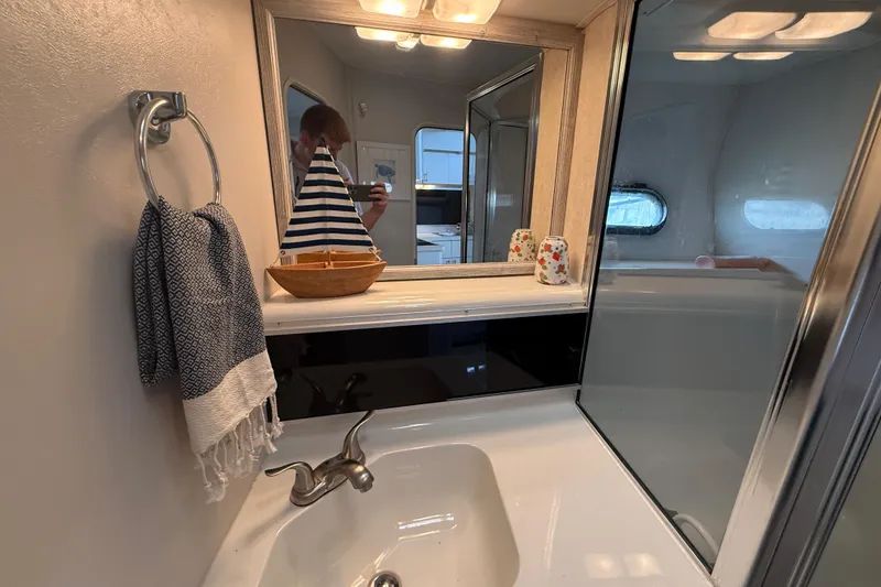 Slide: The Image of Bathroom interior of 1992 Silverton 41 Motor Yacht with nautical decor and modern fixtures. - 39