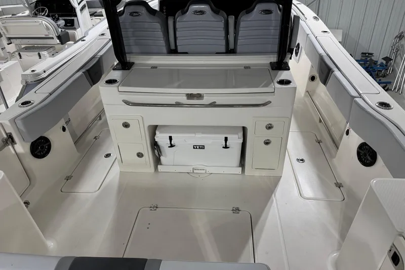 Slide: The Image of 2026 Robalo R300 Center Console boat interior with seating and storage compartments. - 14