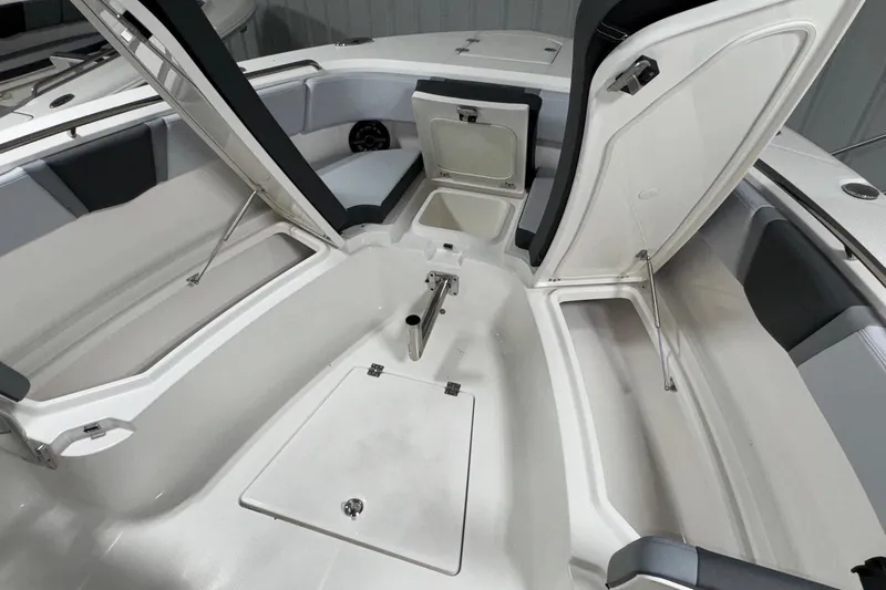 Slide: The Image of 2026 Robalo R300 Center Console boat interior with open storage compartments. - 21