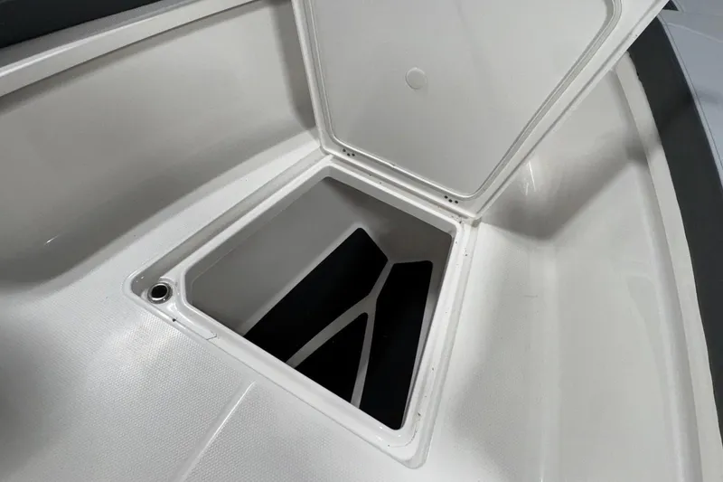 Slide: The Image of Open storage compartment on 2026 Robalo R300 Center Console boat. - 22