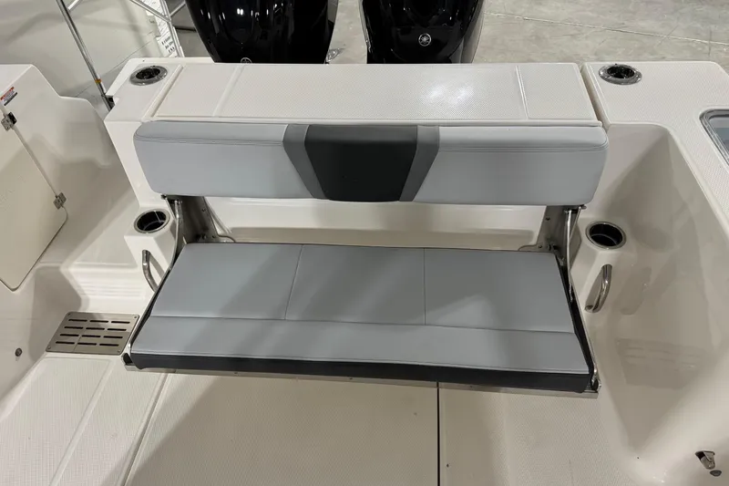 Slide: The Image of 2026 Robalo R300 Center Console boat with foldable rear seating. - 26