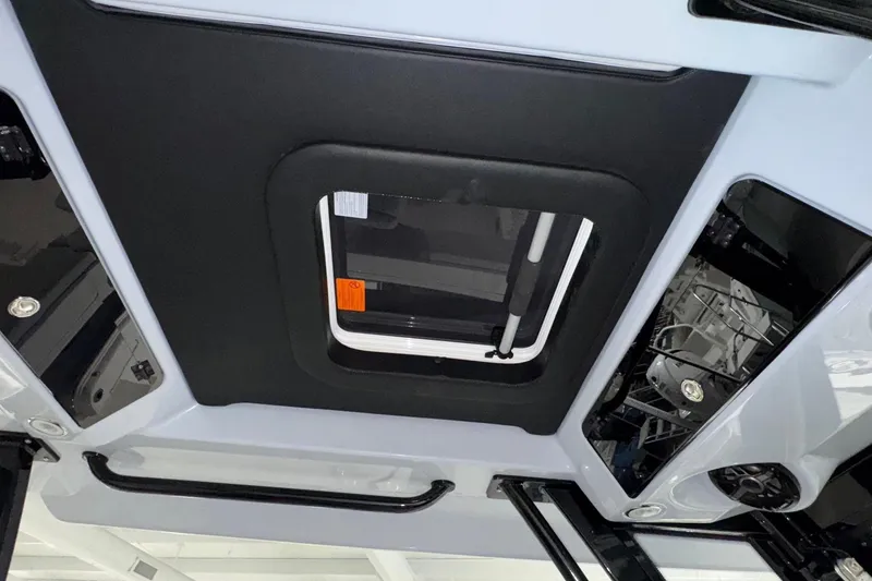 Slide: The Image of 2026 Robalo R300 Center Console boat interior ceiling with hatch and speaker system. - 9