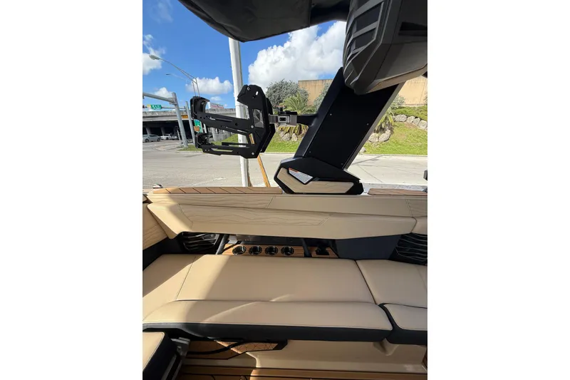 Slide: The Image of Interior of 2026 Nautique Super Air Nautique G25 Coastal Edition with beige seating and sleek design. - 8