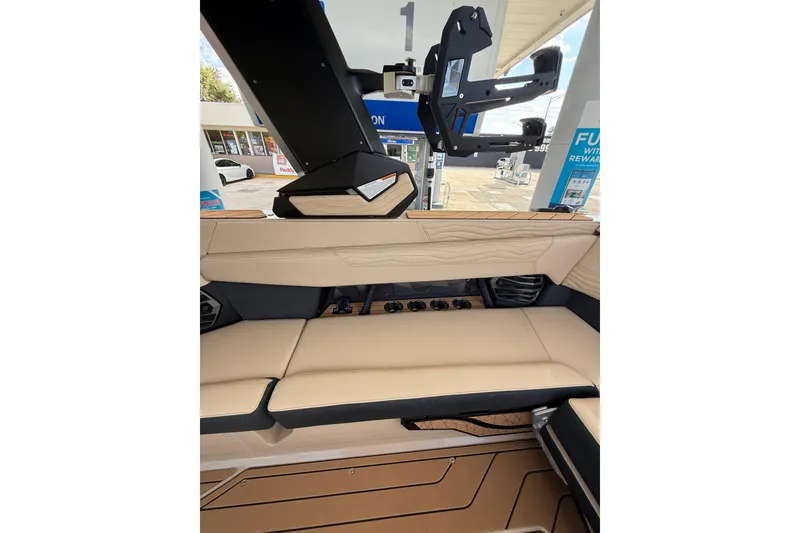 Slide: The Image of Interior of 2026 Nautique Super Air Nautique G25 Coastal Edition at a fuel station. - 9