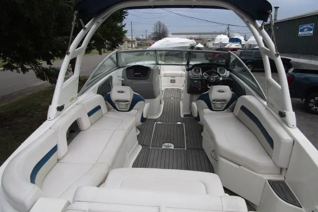 Slide: The Image of 2016 Chaparral 264 Sunesta boat interior with white seating and modern dashboard. - 5