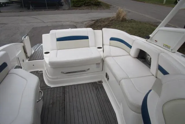 Slide: The Image of 2016 Chaparral 264 Sunesta boat interior with white and blue seating. - 8