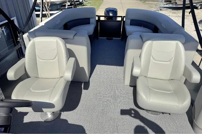 Slide: The Image of 2026 SunChaser Vista LR DH pontoon boat interior with plush seating and modern design. - 5