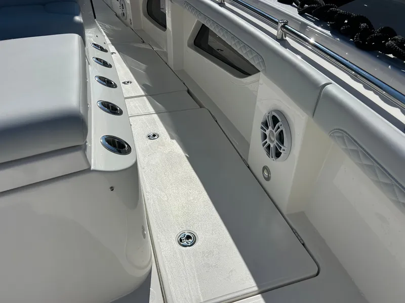 Slide: The Image of The image shows the deck of a 2027 Aquila A36MC with speakers and cup holders. - 31