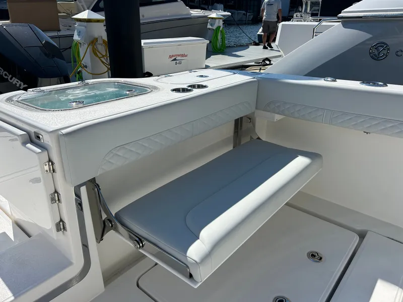 Slide: The Image of The 2027 Aquila A36MC features a foldable bench seat in the cockpit area, surrounded by sleek details. - 12