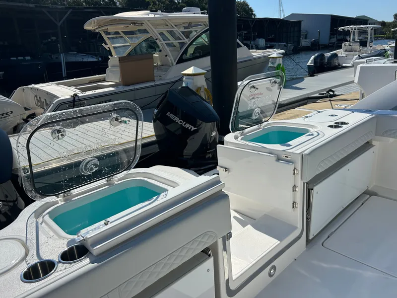 Slide: The Image of The image shows the deck of a 2027 Aquila A36MC with two sinks and storage space. - 10