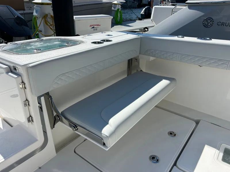Slide: The Image of The 2027 Aquila A36MC features a sleek, white bench seat in the cockpit area. - 11