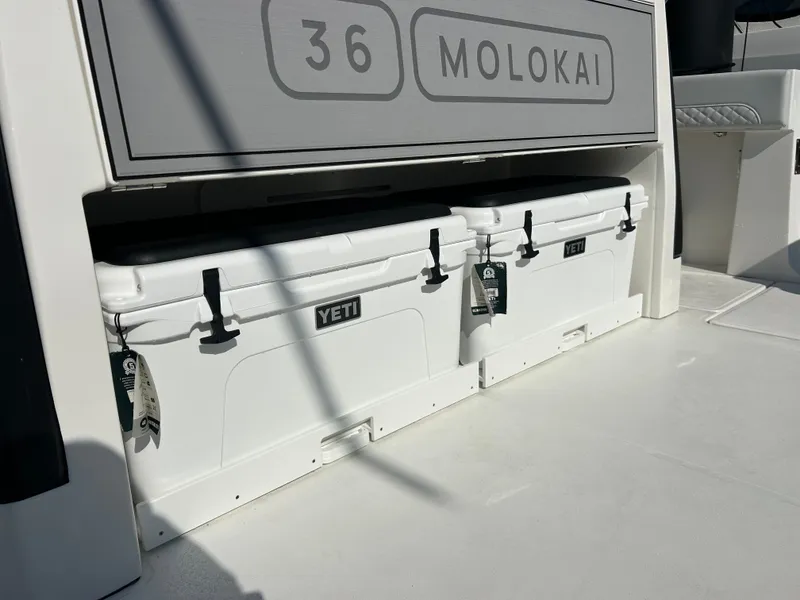 Slide: The Image of Two white Yeti coolers are visible on the deck of a 2027 Aquila A36MC. - 22