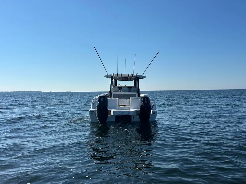 Slide: The Image of A 2027 Aquila A36MC on calm water under a clear sky. - 7