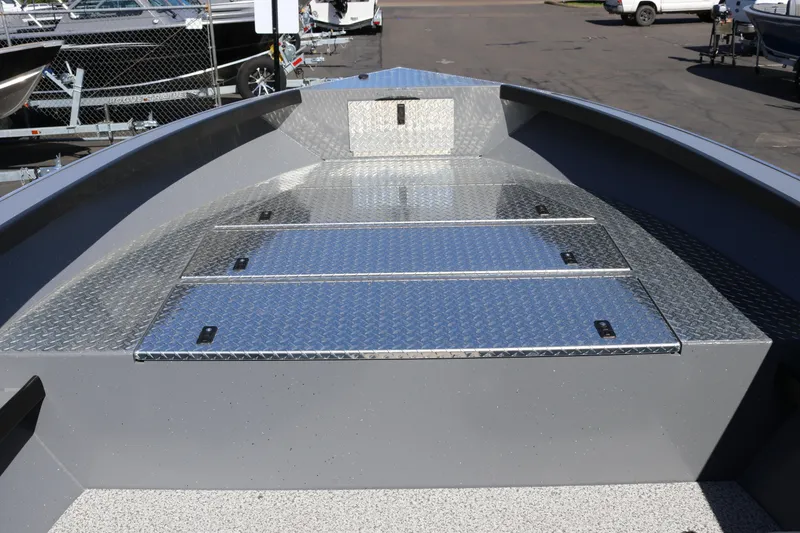 Slide: The Image of Alumaweld Columbia 21 boat deck, 2026 model, featuring diamond plate flooring. - 10