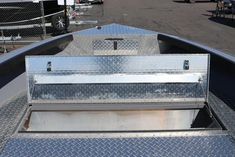 Slide: The Image of Open storage compartment on 2026 Alumaweld Columbia 21 boat, showcasing metal construction. - 13