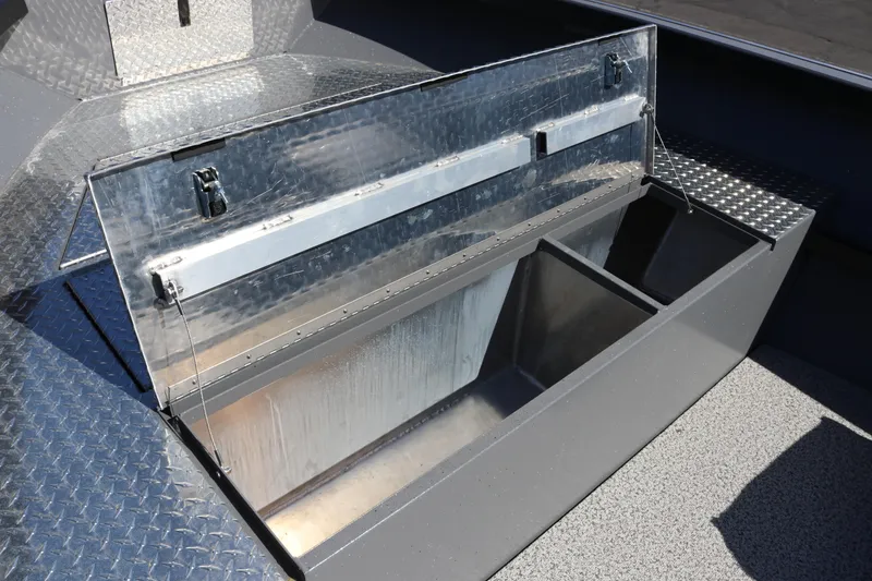 Slide: The Image of Open storage compartment on 2026 Alumaweld Columbia 21 boat, featuring durable metal construction. - 16