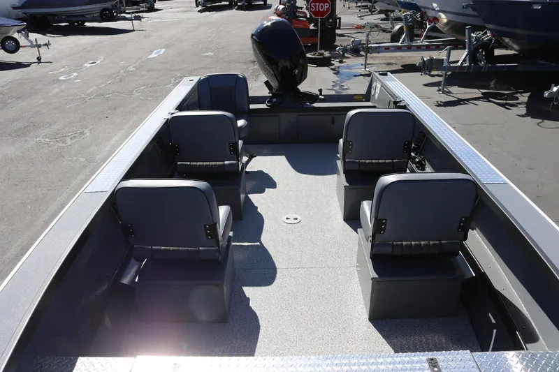 Slide: The Image of 2026 Alumaweld Columbia 21 boat interior with four seats and outboard motor. - 17