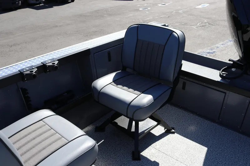 Slide: The Image of 2026 Alumaweld Columbia 21 boat interior with cushioned seating and durable flooring. - 19