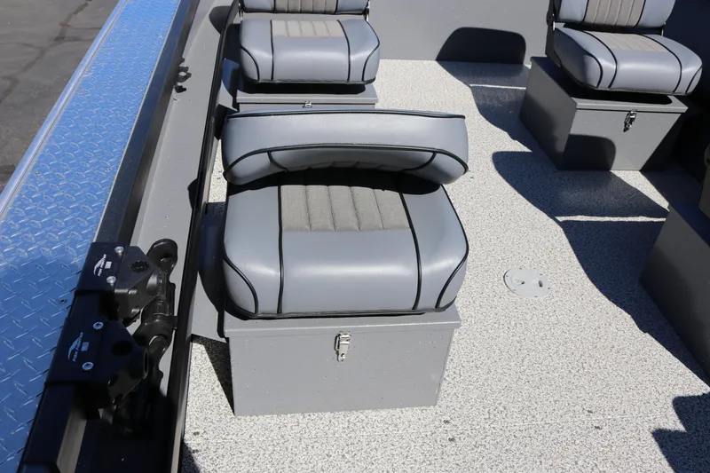 Slide: The Image of 2026 Alumaweld Columbia 21 boat interior with gray cushioned seats and storage compartments. - 20