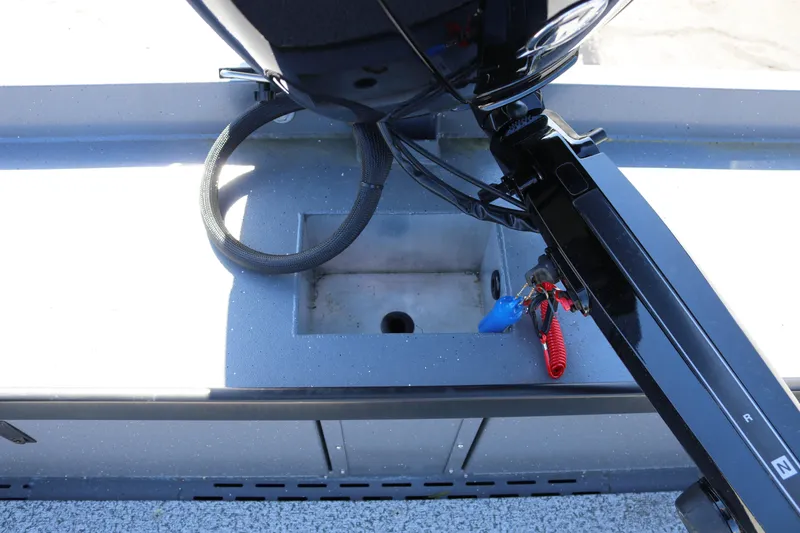 Slide: The Image of 2026 Alumaweld Columbia 21 boat interior with motor and control cables. - 26