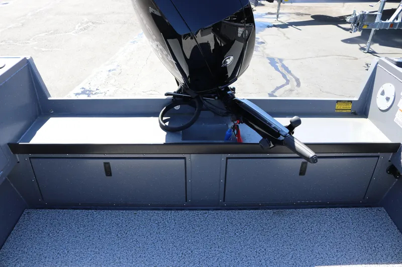 Slide: The Image of 2026 Alumaweld Columbia 21 boat interior with motor and storage compartments. - 27